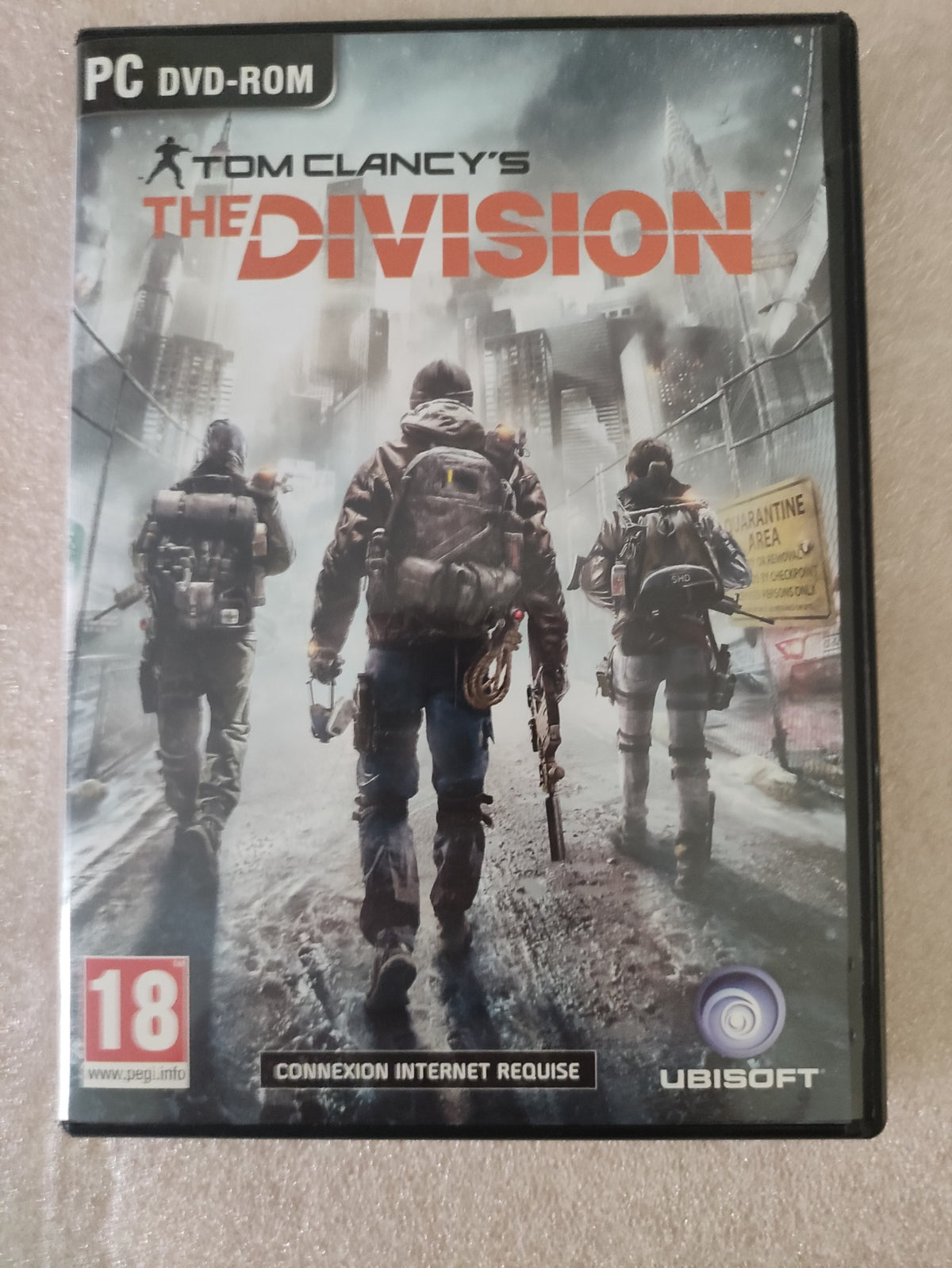 Jeu PC Tom Clancy’s The Division Ubisoft version française, boîte avec couverture du jeu et logo visible.