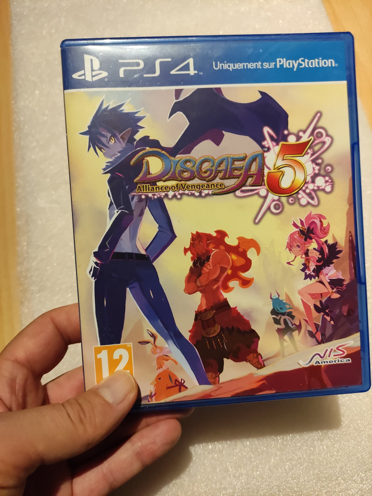 Jeu PS4 Disgaea 5 : Alliance of Vengeance de NIS America, affiche du jeu avec personnages et logo coloré.